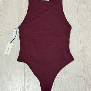 Aritzia Red Bodysuit with Sleeveless Design and High Neckline